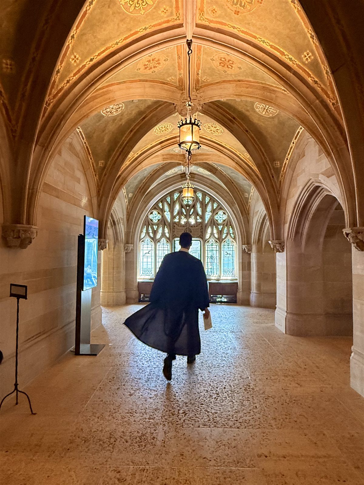 Walking through Yale's cloisters in commencement robes